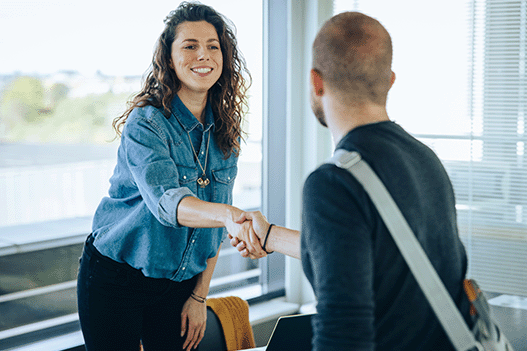 Woman and man shaking hands